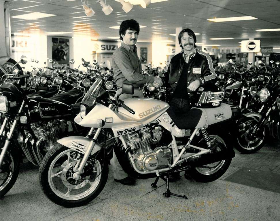 1980s McBride Cycle showroom with a McBride-branded Suzuki race bike